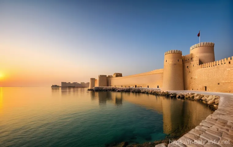 바레인의 역사적 성벽 - **"A majestic wide-angle view of Qal'at al-Bahrain (Bahrain Fort) at sunset. The ancient Portuguese ...